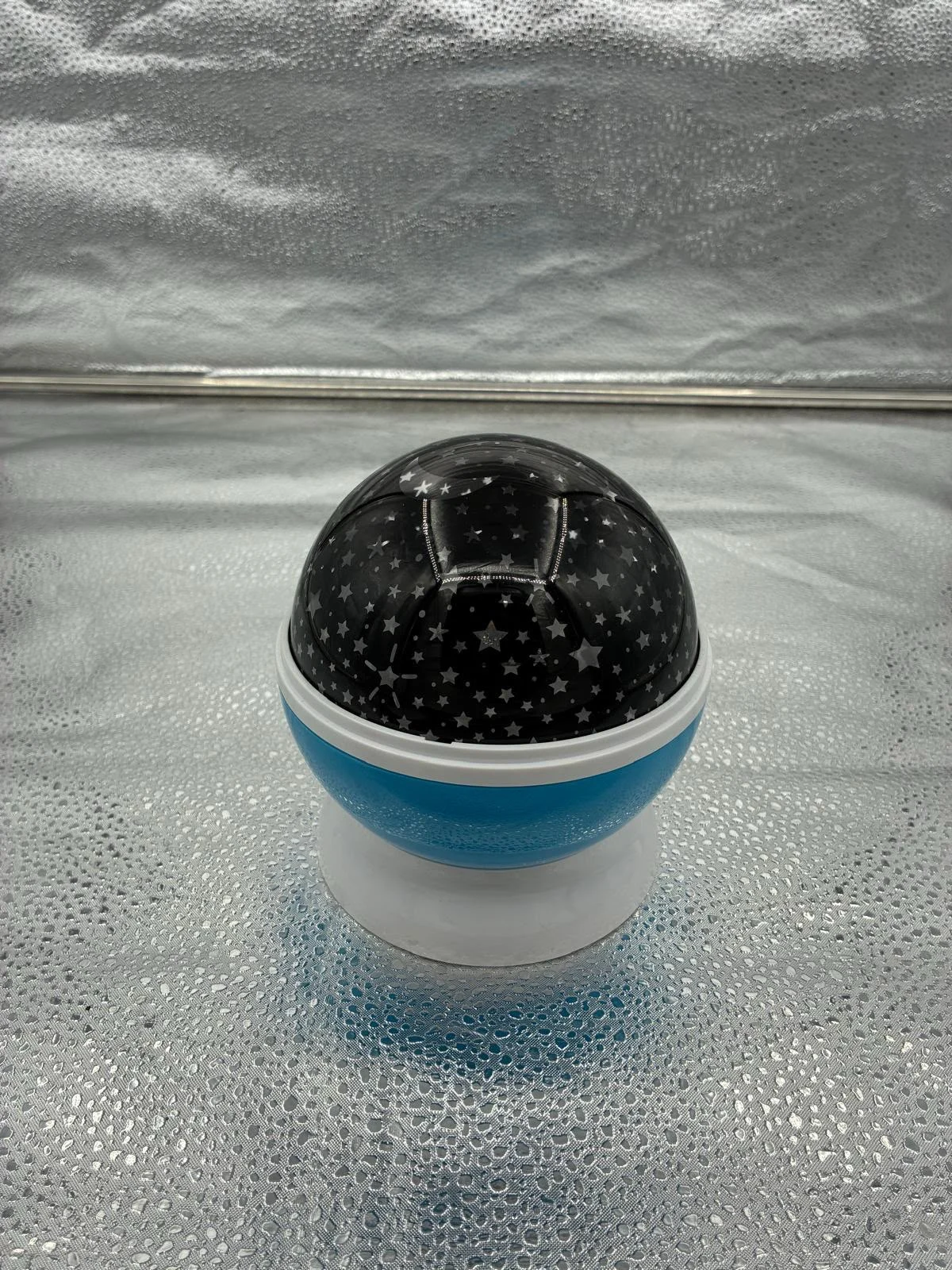 Camera in a rounded star-patterned housing