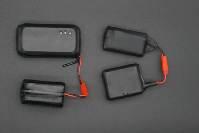 Devices and battery packs arranged to show their connections.