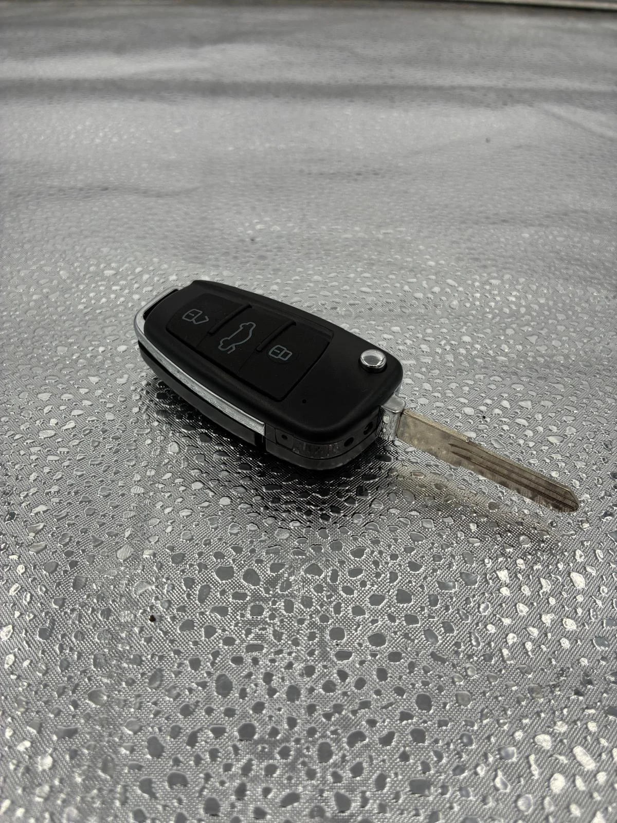 Key-style camera with buttons and a metal key blade at SPY WORLD