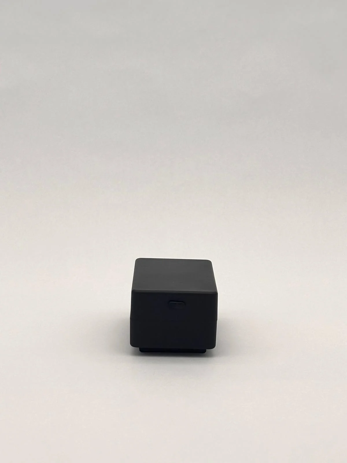 Another view of the black housing and its base.
