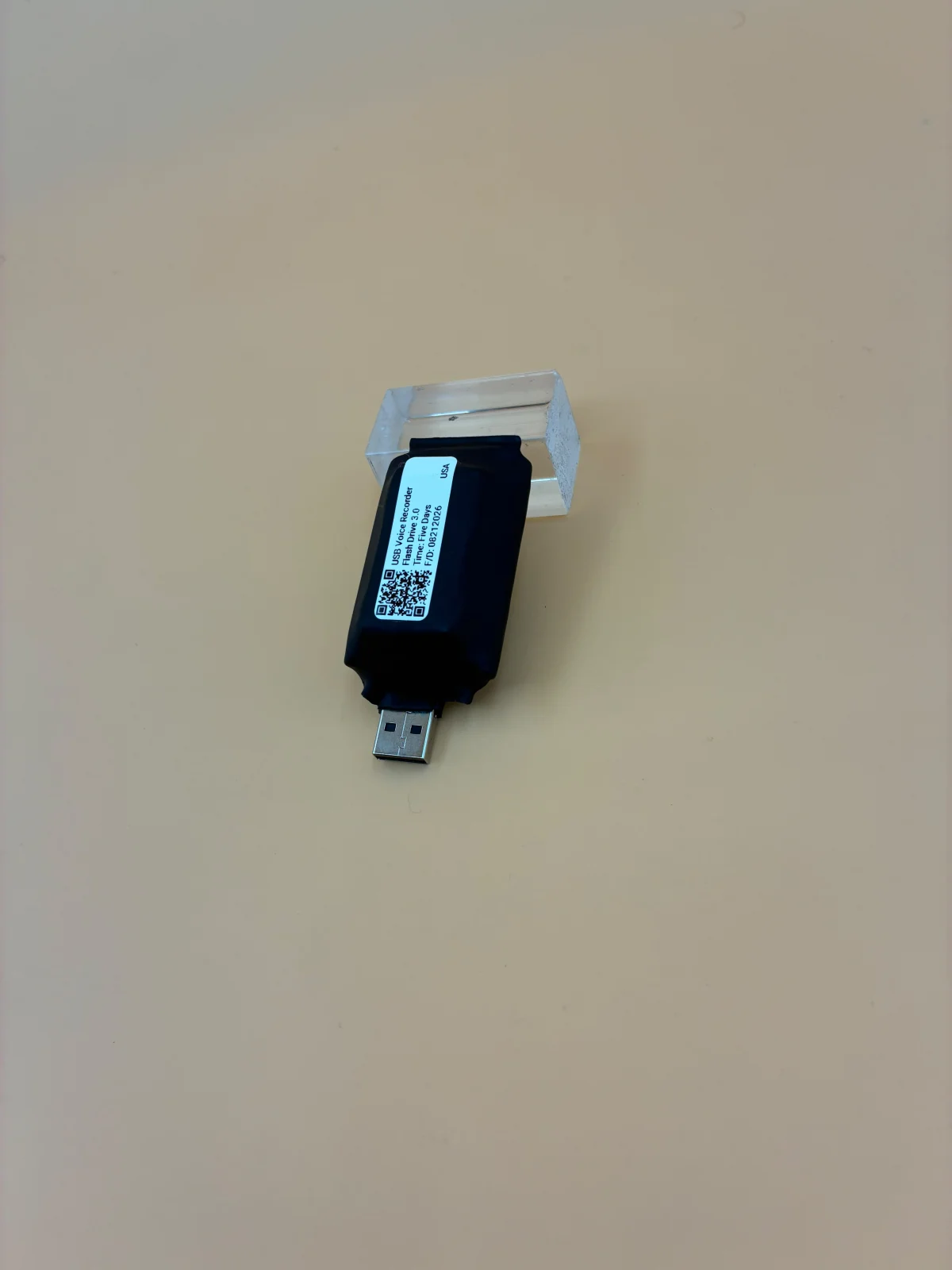 Another labeled unit photographed at an angle on a display support.