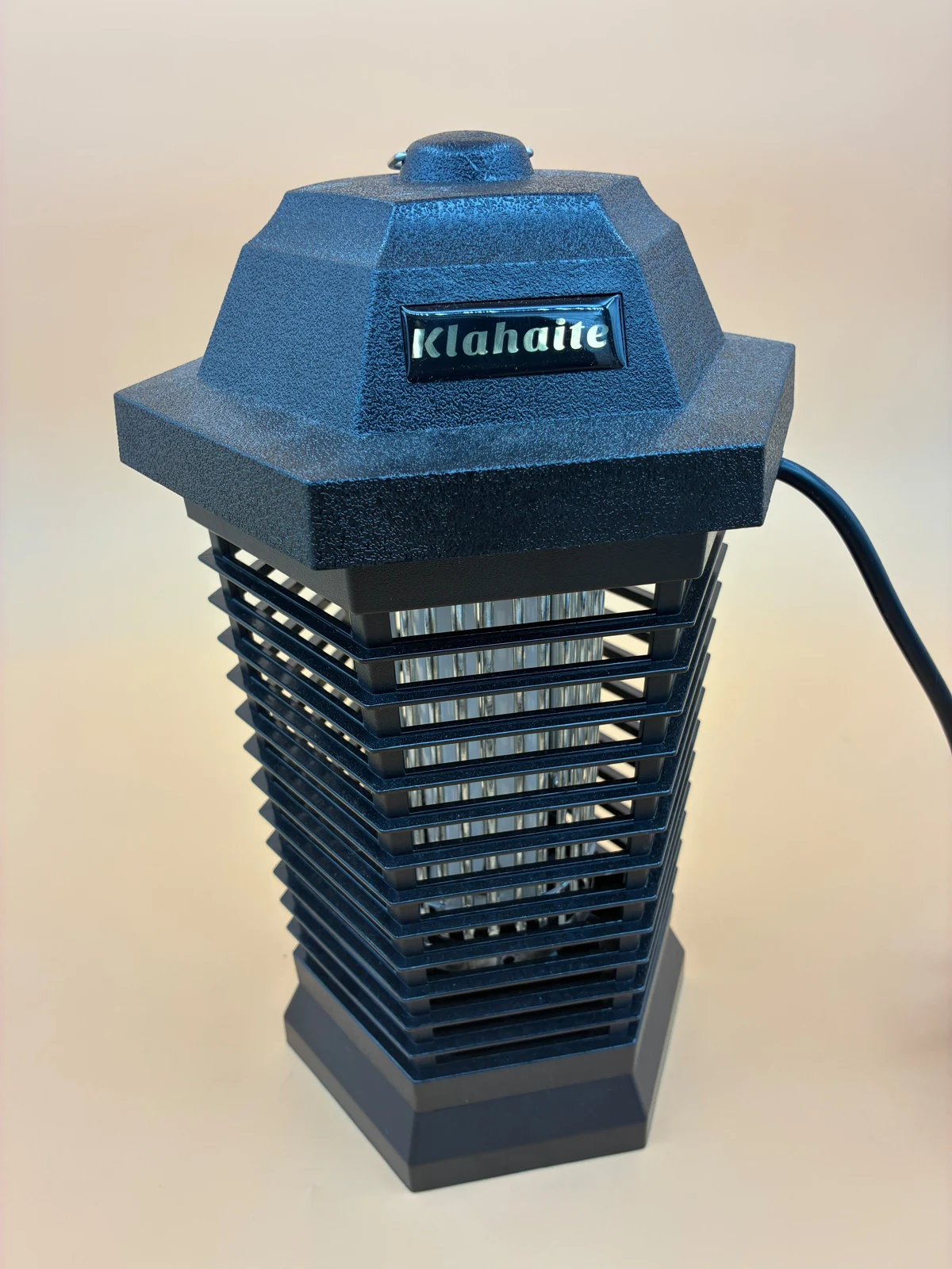 Outdoor camera in a blue insect-zapper-style housing