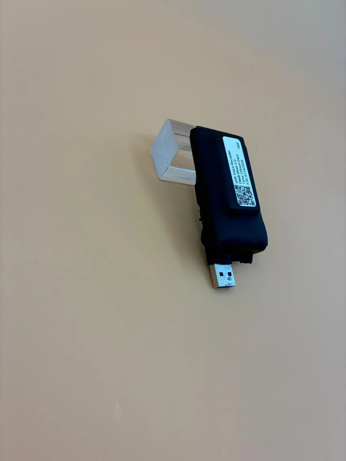 Another unit viewed from its labeled side, with the USB connector visible.