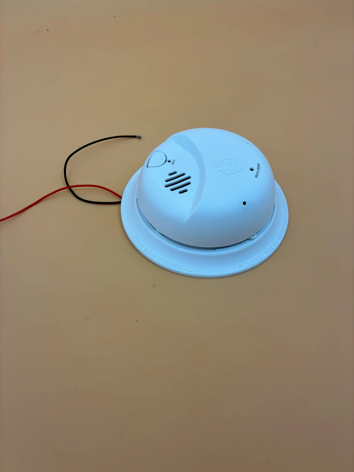 Smoke alarm camera with visible wiring
